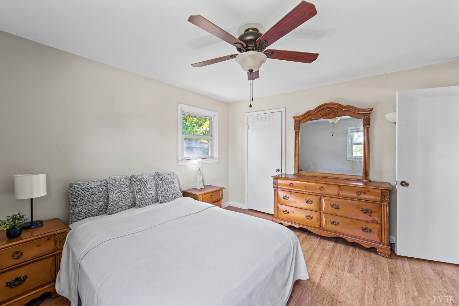 212 Ogden Road Altavista, VA 24517 - Photo 14 of 26 a bedroom with a bed a dresser and painting on the wall