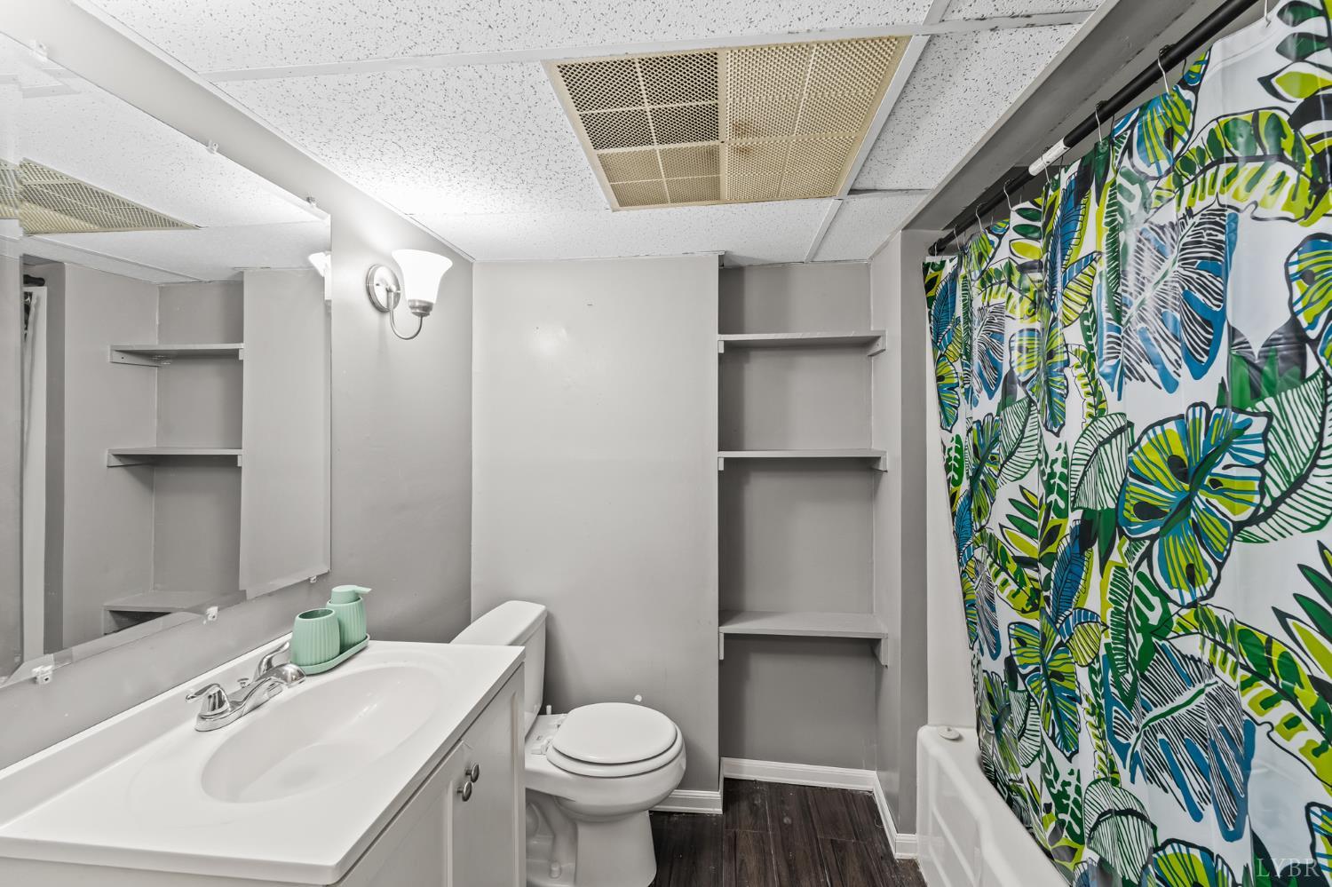 212 Ogden Road Altavista, VA 24517 - Photo 15 of 26 a bathroom with a sink and mirror with toilet
