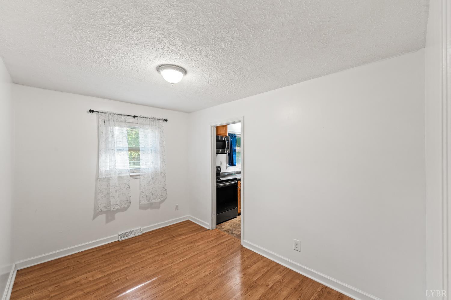 212 Ogden Road Altavista, VA 24517 - Photo 9 of 26 a view of a hardwood floor in a room