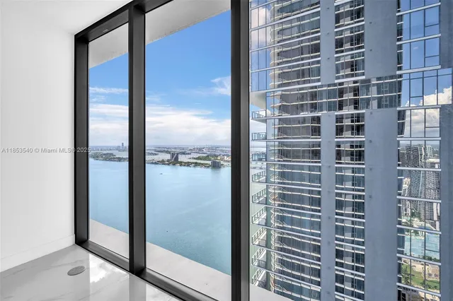 a view of a lake with tall building next to a lake