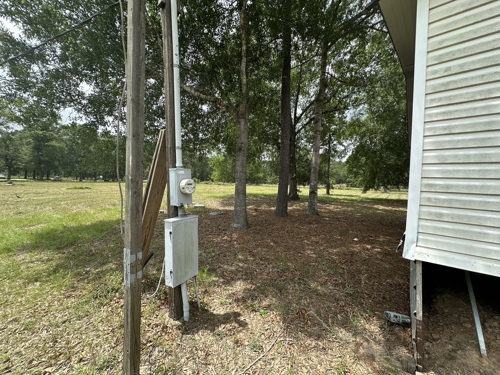 2229 Meekins Road Cleveland, TX 77328 - Photo 39 of 48 a view of a yard with a tree
