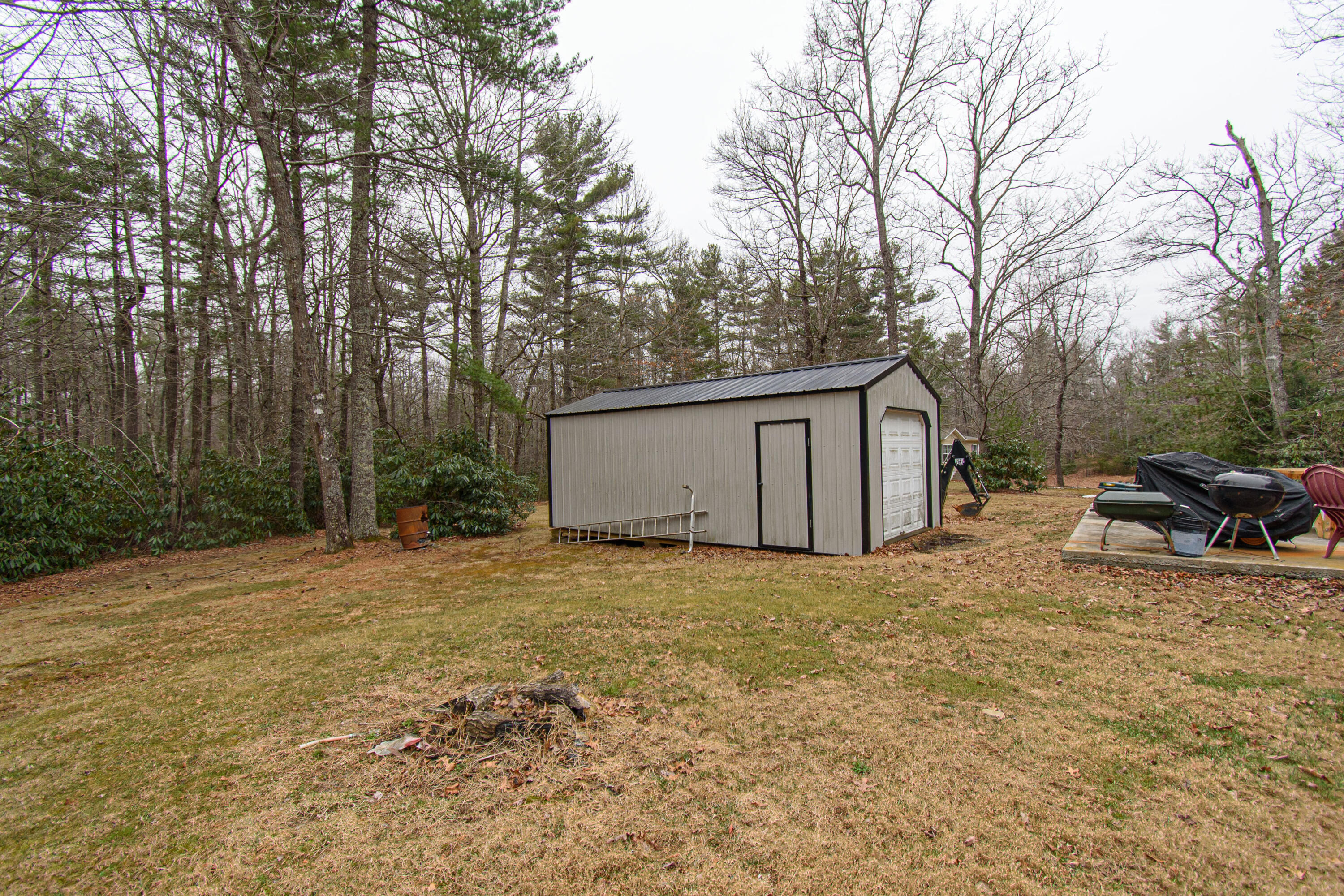 162 Mountain Laurel Way Northeast Check, VA 24072 - Photo 48 of 49 a backyard of a house with table and chairs