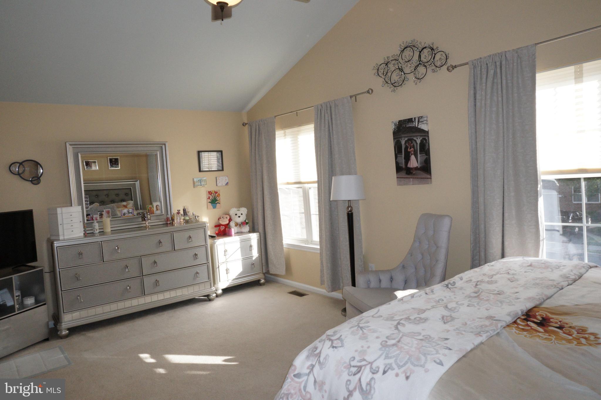 120 Dispatch Drive, Unit 77 Washington Crossing, PA 18977 - Photo 15 of 22 a bedroom with a bed and a dresser