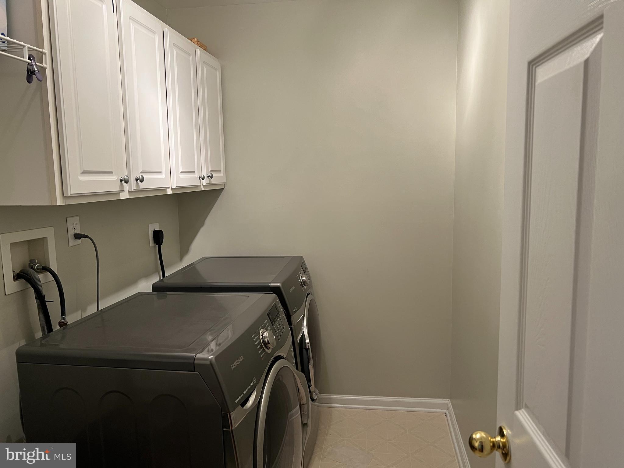 120 Dispatch Drive, Unit 77 Washington Crossing, PA 18977 - Photo 17 of 22 a utility room with dryer and washer