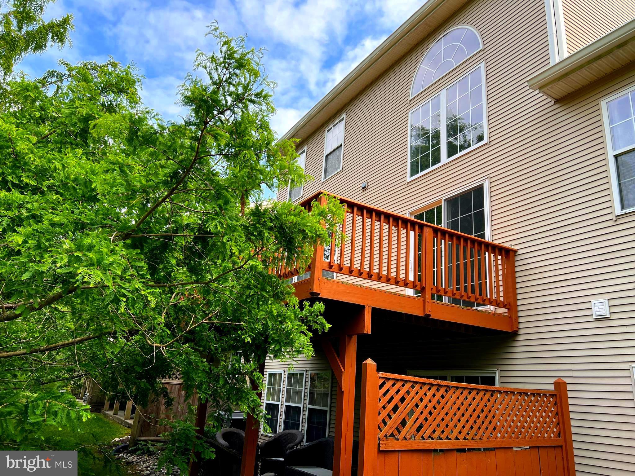 120 Dispatch Drive, Unit 77 Washington Crossing, PA 18977 - Photo 20 of 22 a view of a house with a small deck
