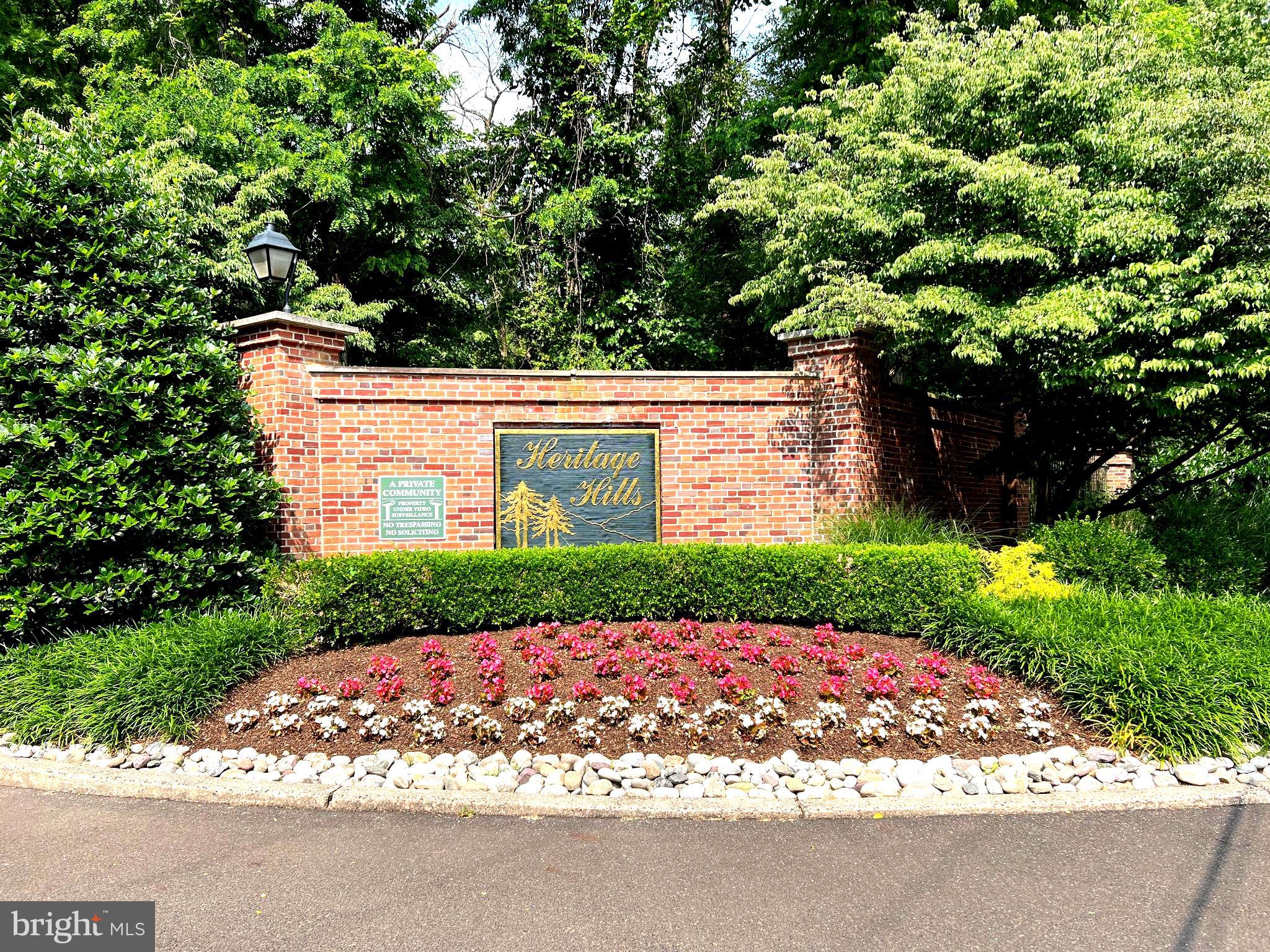 120 Dispatch Drive, Unit 77 Washington Crossing, PA 18977 - Photo 2 of 22 a view of a yard with potted plants