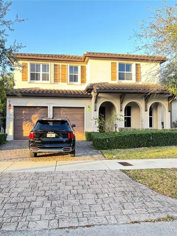 a car parked in front of a house