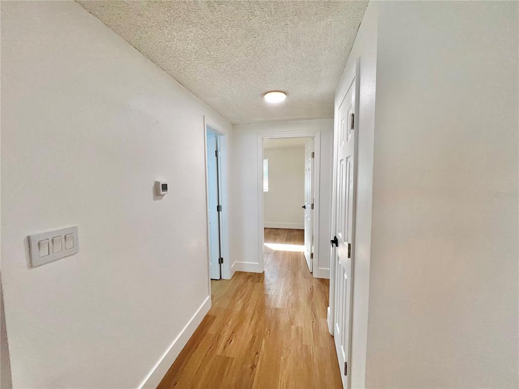 4930 Elkner Street New Port Richey, FL 34652 - Photo 8 of 17 a view of a room with wooden floor