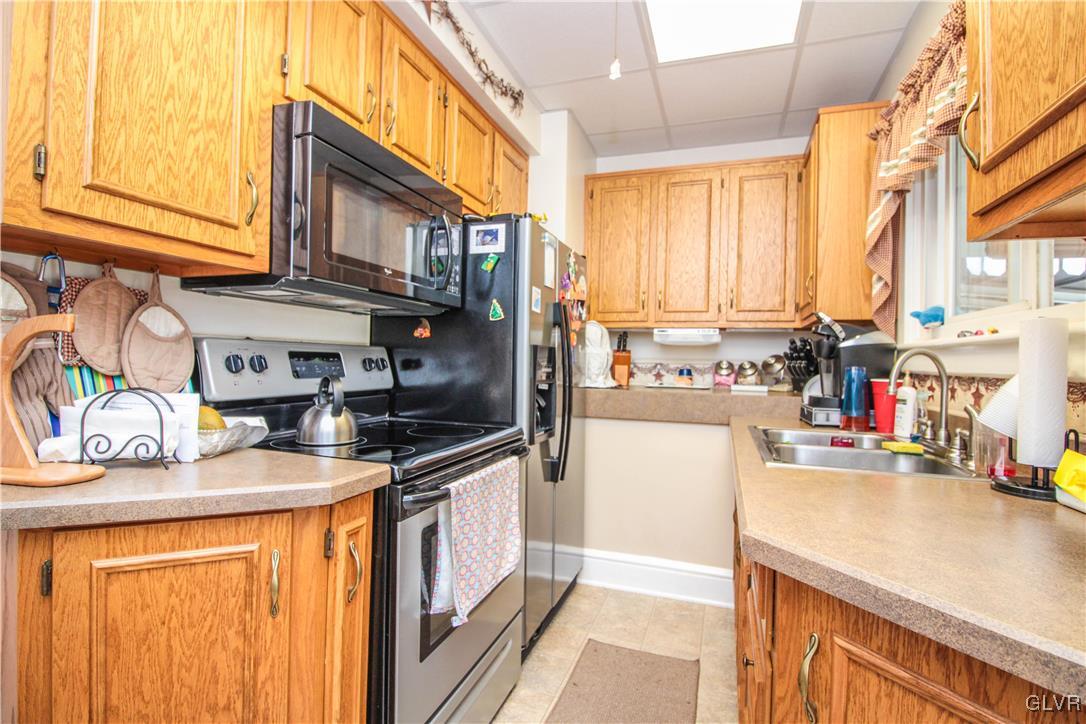 1139 Spring Garden Street Easton, PA 18042 - Photo 11 of 26 a kitchen with stainless steel appliances granite countertop a sink and cabinets