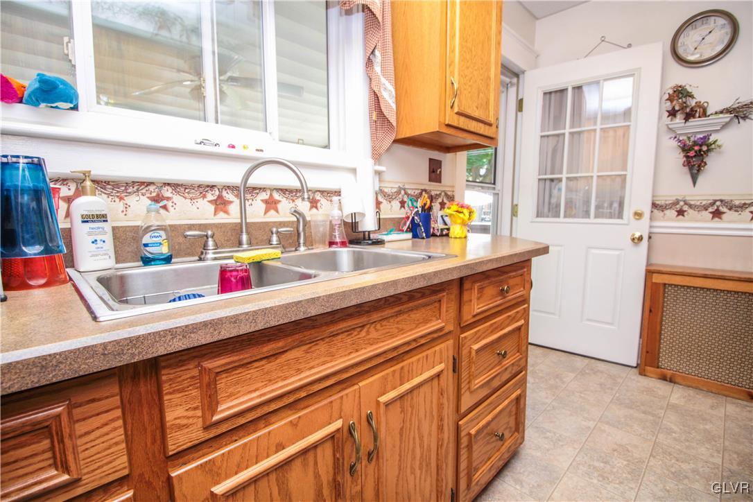 1139 Spring Garden Street Easton, PA 18042 - Photo 12 of 26 a kitchen with stainless steel appliances granite countertop a sink and a window