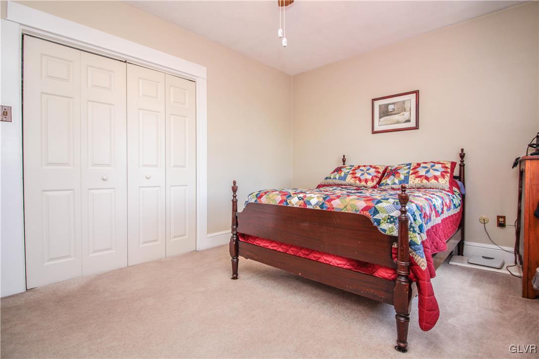 1139 Spring Garden Street Easton, PA 18042 - Photo 17 of 26 a bed room with a bed and a chair