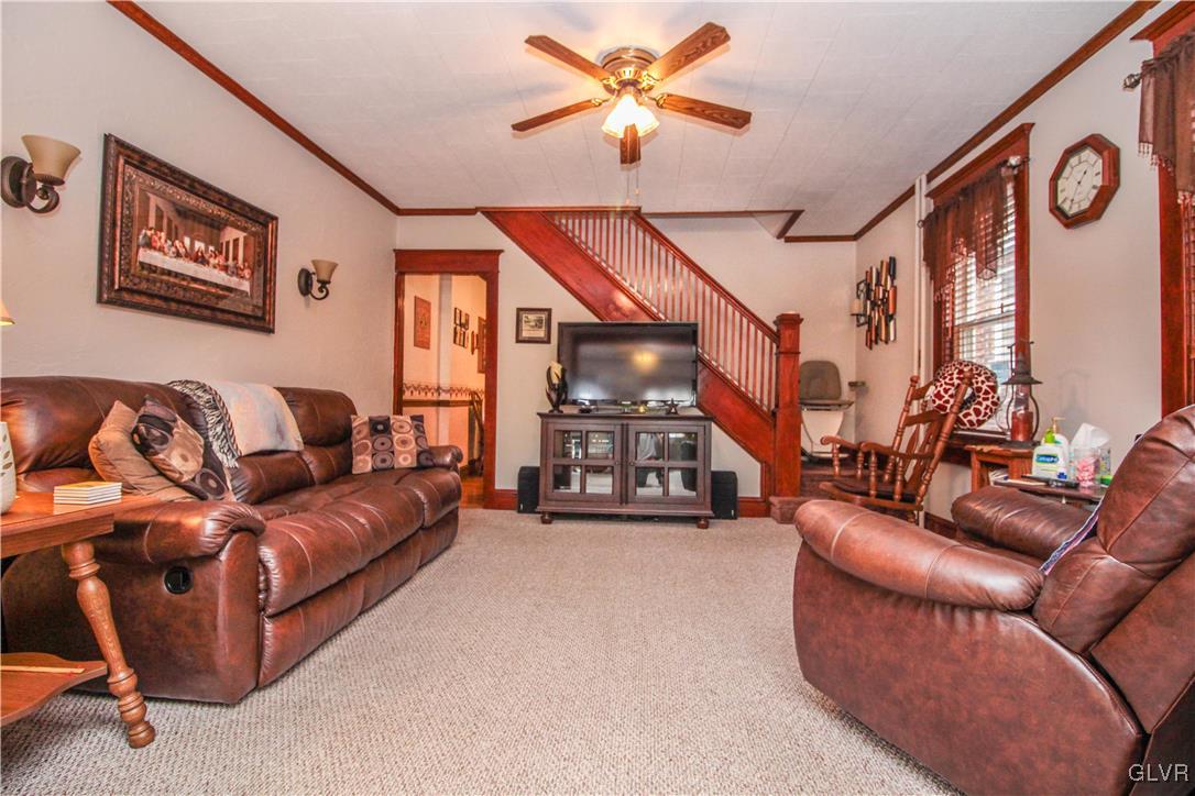 1139 Spring Garden Street Easton, PA 18042 - Photo 6 of 26 a living room with furniture a ceiling fan and a window