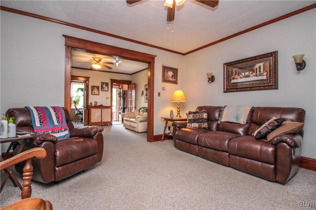 1139 Spring Garden Street Easton, PA 18042 - Photo 7 of 26 a living room with furniture and a chandelier