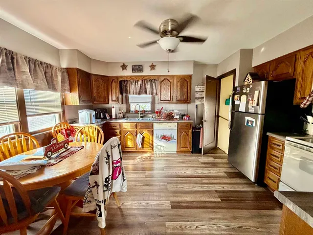 a living room with stainless steel appliances kitchen island granite countertop furniture and a kitchen view