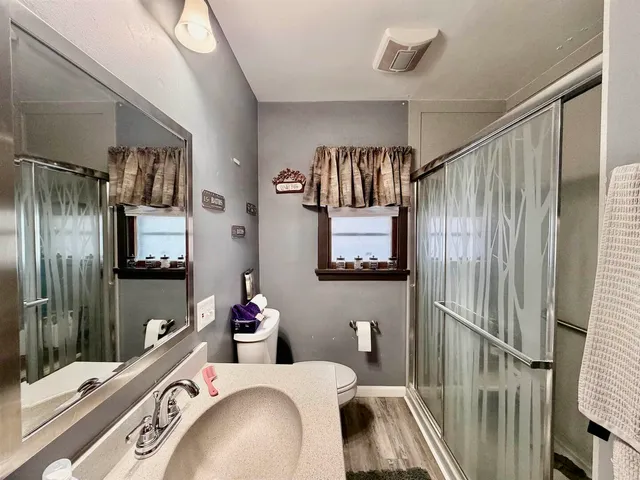 a bedroom with furniture and a window