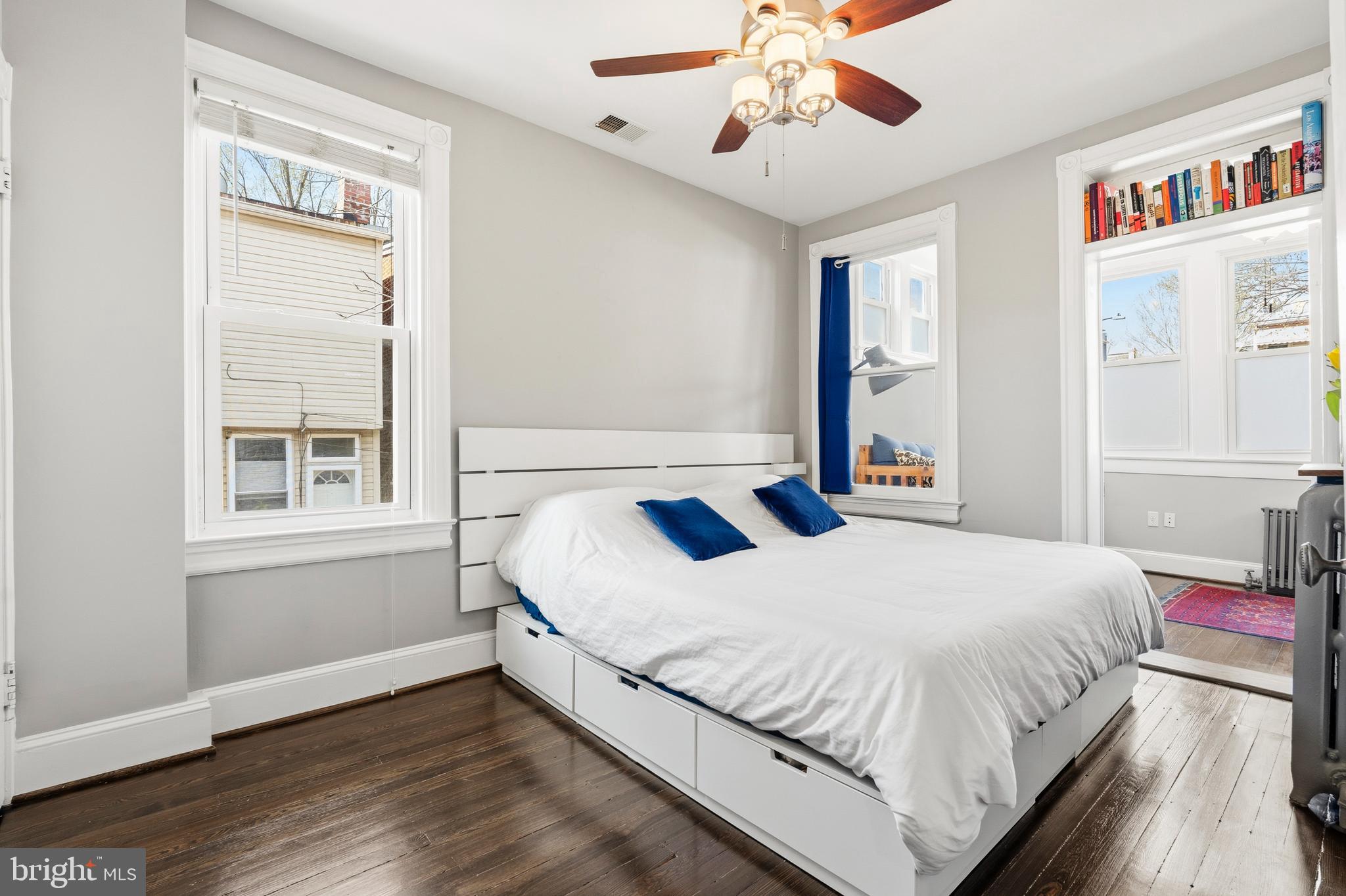 148 Todd Place Northeast Washington, DC 20002 - Photo 21 of 43 a bedroom with a large bed and a chandelier