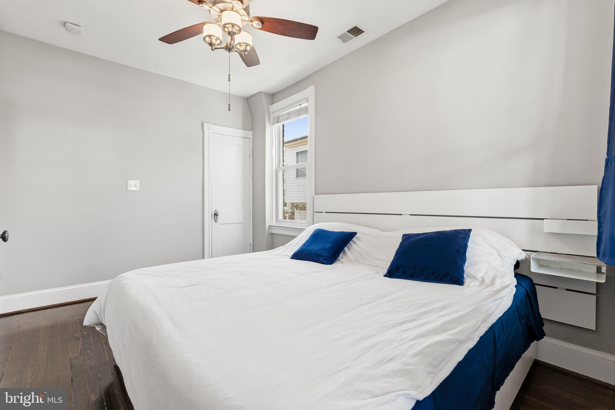 148 Todd Place Northeast Washington, DC 20002 - Photo 22 of 43 a bedroom with a large bed and a chandelier