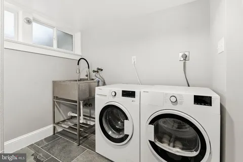 a bathroom with a bathtub and a sink