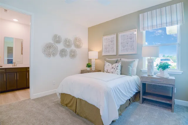 a bedroom with a bed and a cabinets