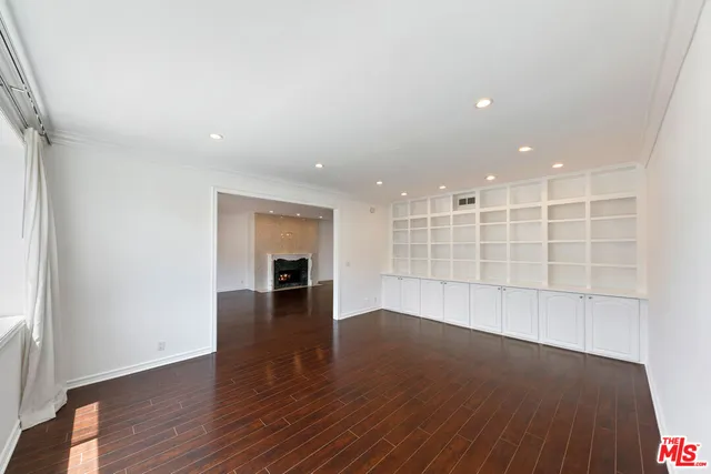a view of a dining room with furniture wooden floor and chandelier