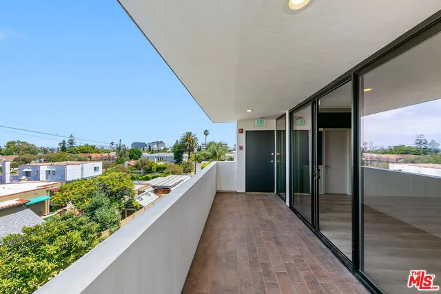 a hallway with wooden floor