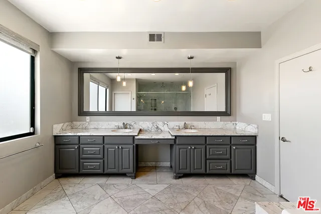 a bathroom with a bathtub and shower