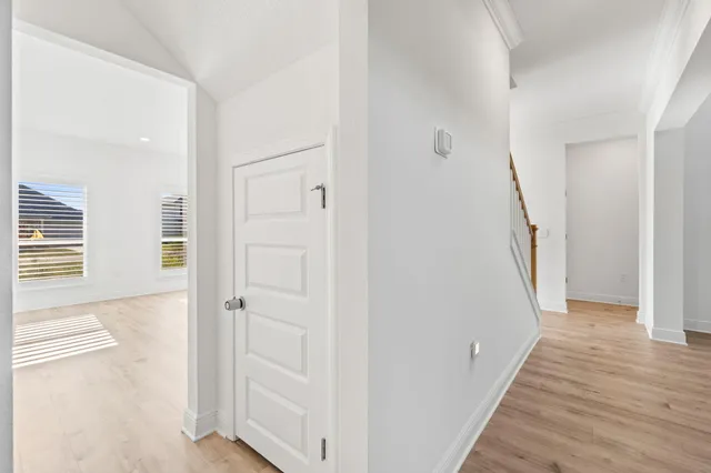 a spacious bathroom with a double vanity sink a large mirror and shower