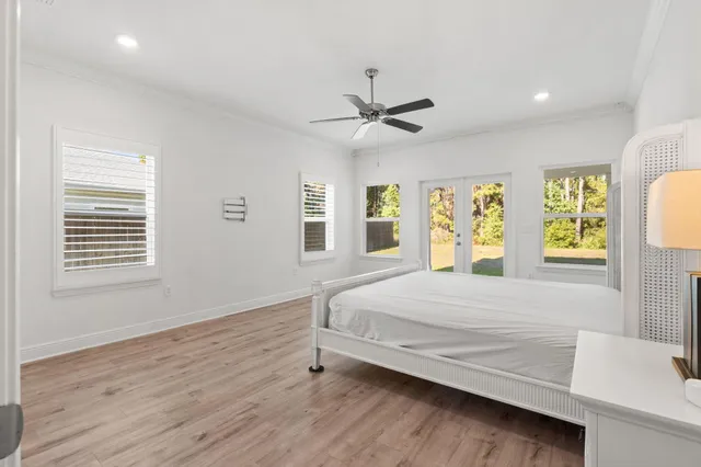 a kitchen with stainless steel appliances granite countertop a table chairs sink refrigerator and cabinets