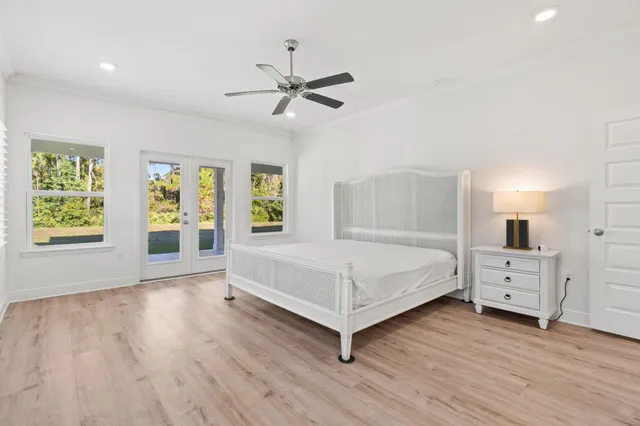 a kitchen with stainless steel appliances granite countertop a sink and white cabinets
