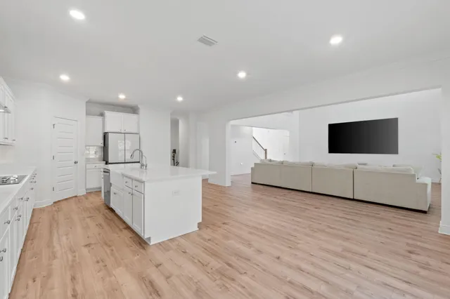 a large white bed in a white room