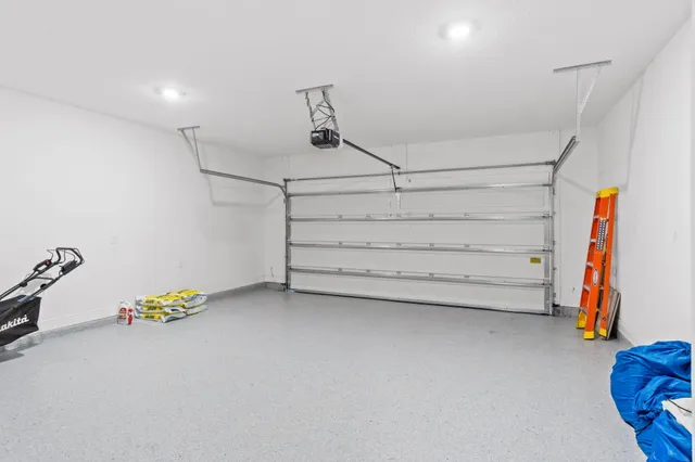 an aerial view of residential houses with outdoor space and swimming pool