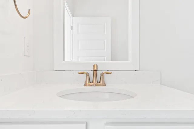 a view of an empty room and wooden floor