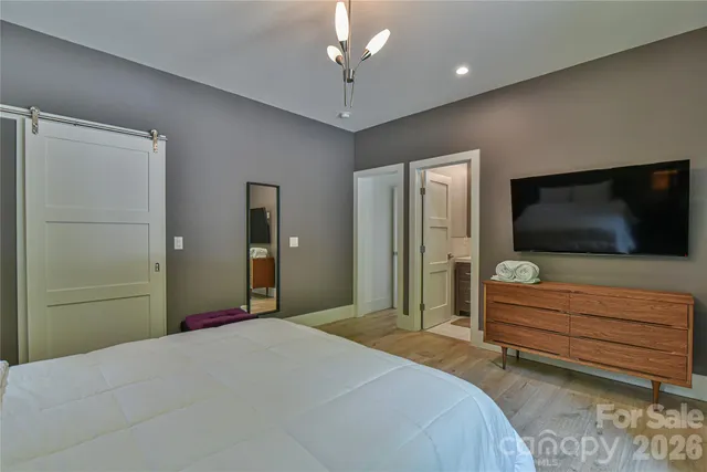 a bathroom with a sink mirror vanity and toilet