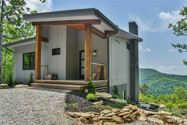 a view of a two chairs in the balcony
