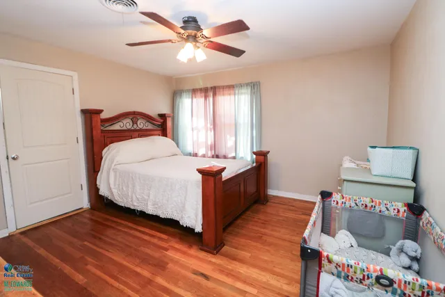 a bedroom with a bed and a dresser