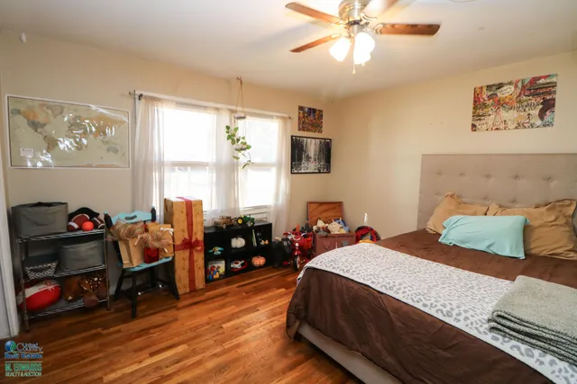 a bedroom with a bed and a mirror