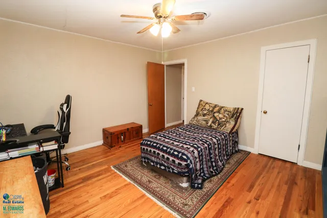 a front door with a sink and a mirror