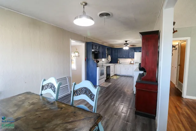 a kitchen that has a stove and a table