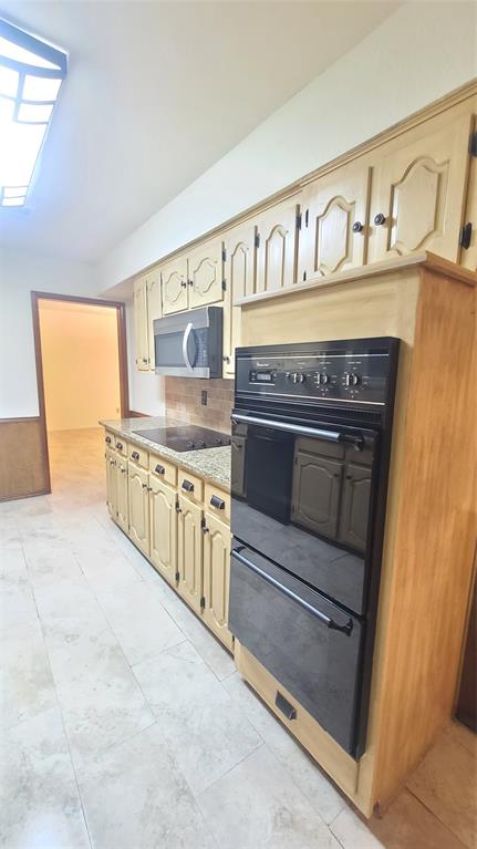 2728 Cross Bend Road Plano, TX 75023 - Photo 5 of 17 a kitchen with stove and cabinets