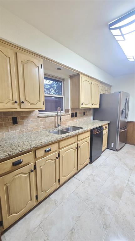 2728 Cross Bend Road Plano, TX 75023 - Photo 6 of 17 a kitchen with granite countertop a sink stainless steel appliances and cabinets
