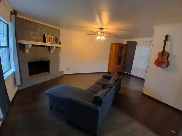 a living room with furniture flat screen tv and a fireplace