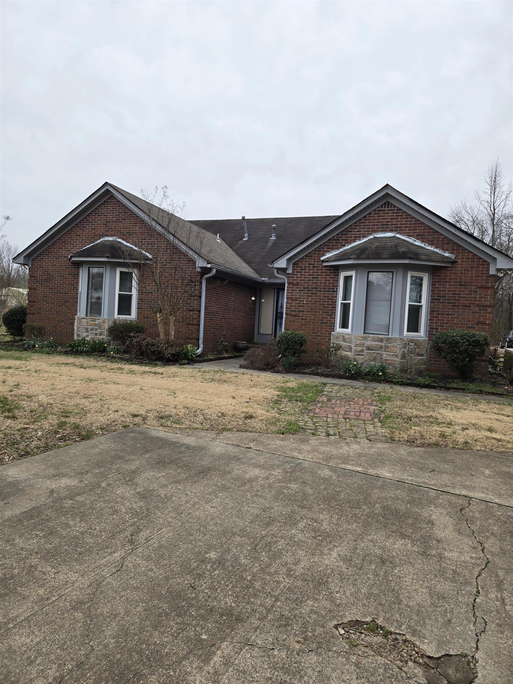 3595 Lucy Road Millington, TN 38053 - Photo 3 of 10 Ranch-style home featuring brick siding and a front yard