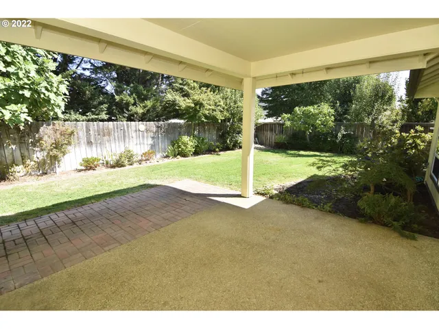 a view of a yard with an outdoor space