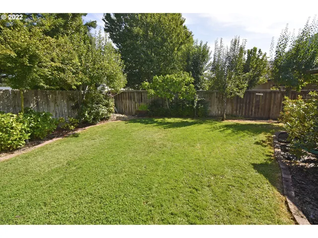 a view of backyard with seating space