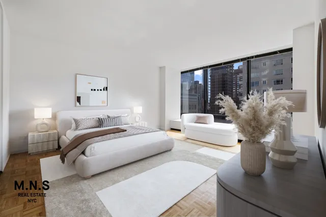 a living room with furniture a large window and a flat screen tv