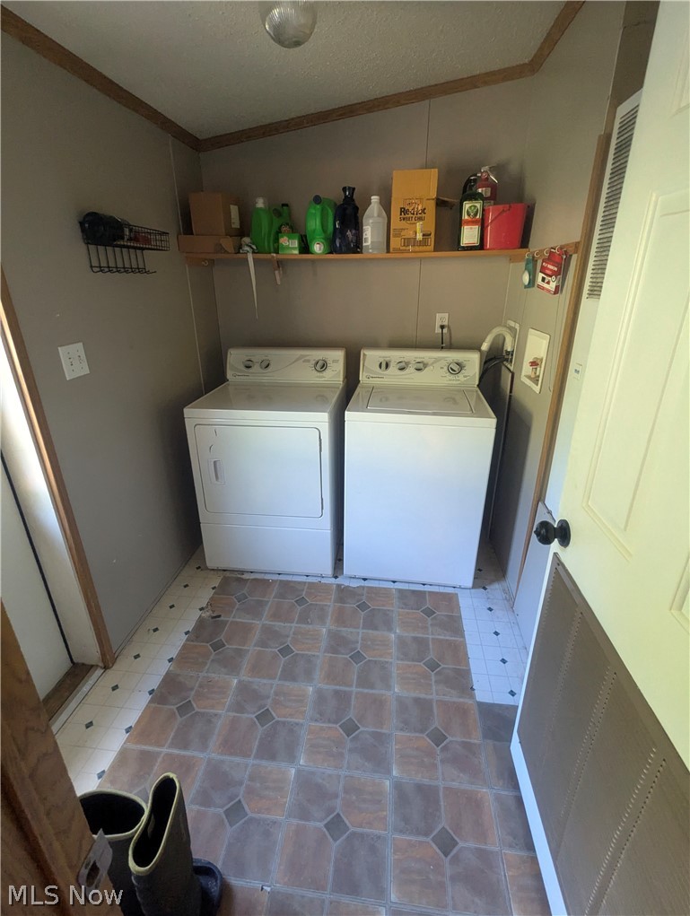 17960 Raven Road Salesville, OH 43778 - Photo 26 of 27 Dedicated laundry area and mud room featuring patterned tile-look flooring.