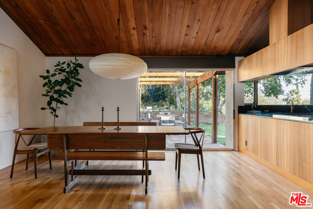 390 North San Rafael Avenue Pasadena, CA 91105 - Photo 12 of 39 a view of a dining room with furniture window and wooden floor