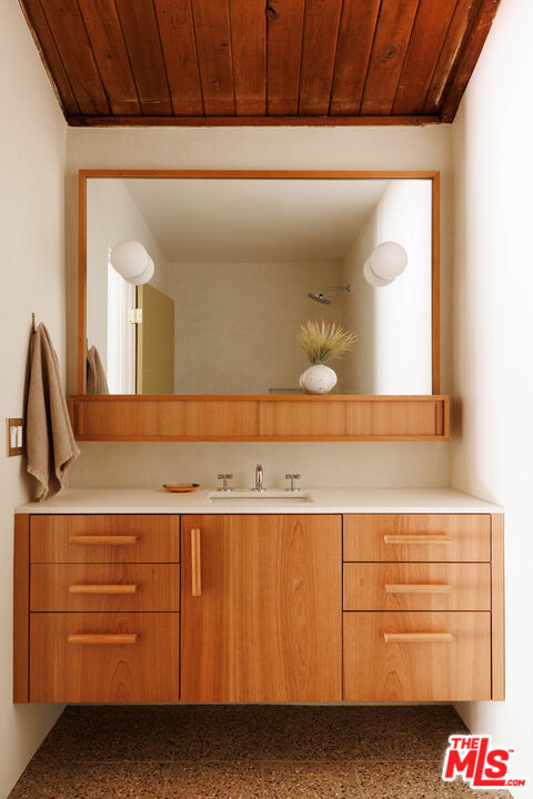 390 North San Rafael Avenue Pasadena, CA 91105 - Photo 21 of 39 a bathroom with a sink and a mirror