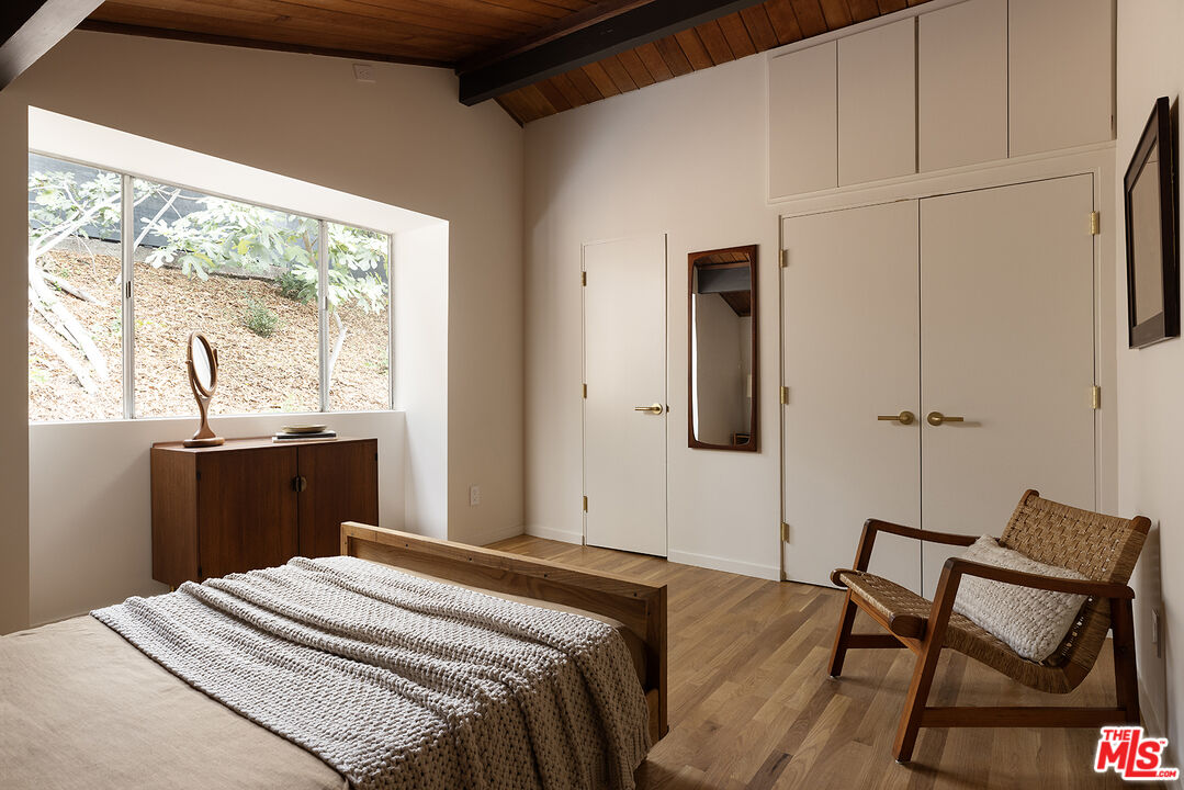 390 North San Rafael Avenue Pasadena, CA 91105 - Photo 24 of 39 a bedroom with a bed and a window