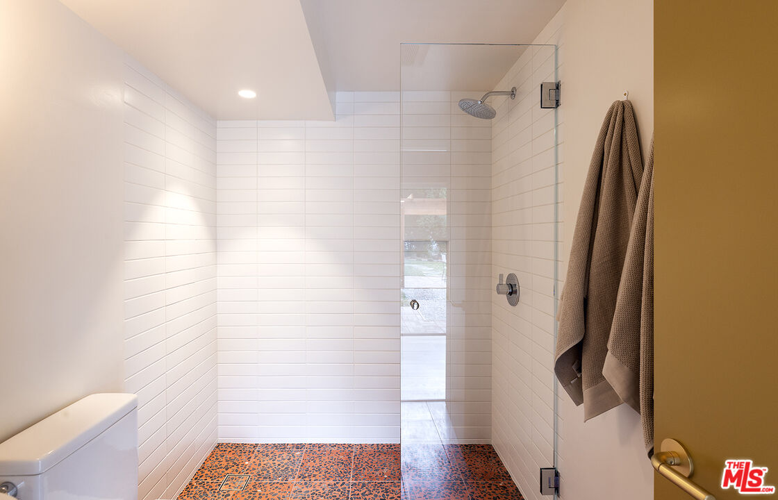 390 North San Rafael Avenue Pasadena, CA 91105 - Photo 25 of 39 a bathroom with a shower and a toilet